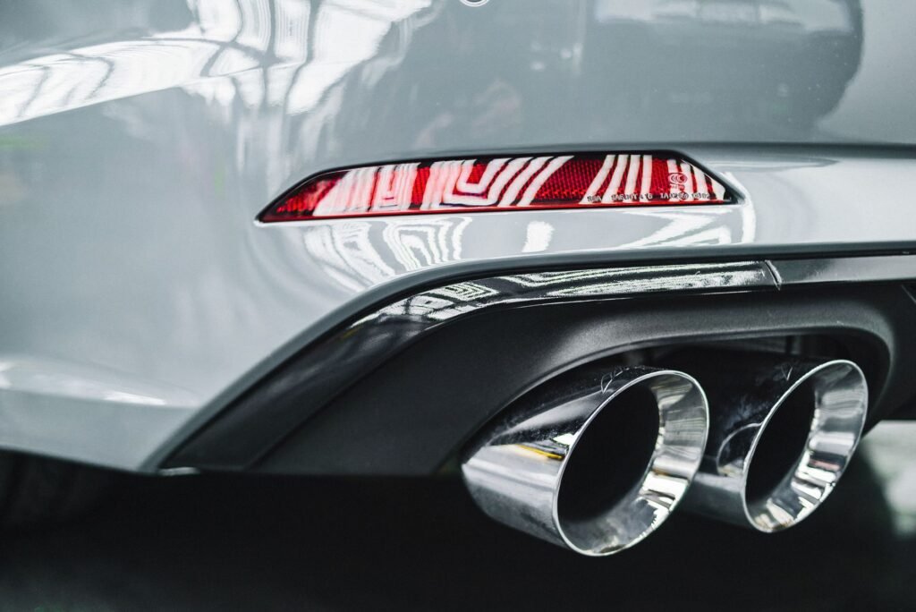 Close-up of a car exhaust pipe, representing pops and bangs remapping in the UK